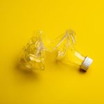 clear glass bottle with white cap